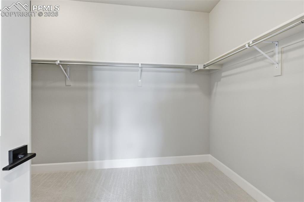 Walk in closet in the owners' suite 