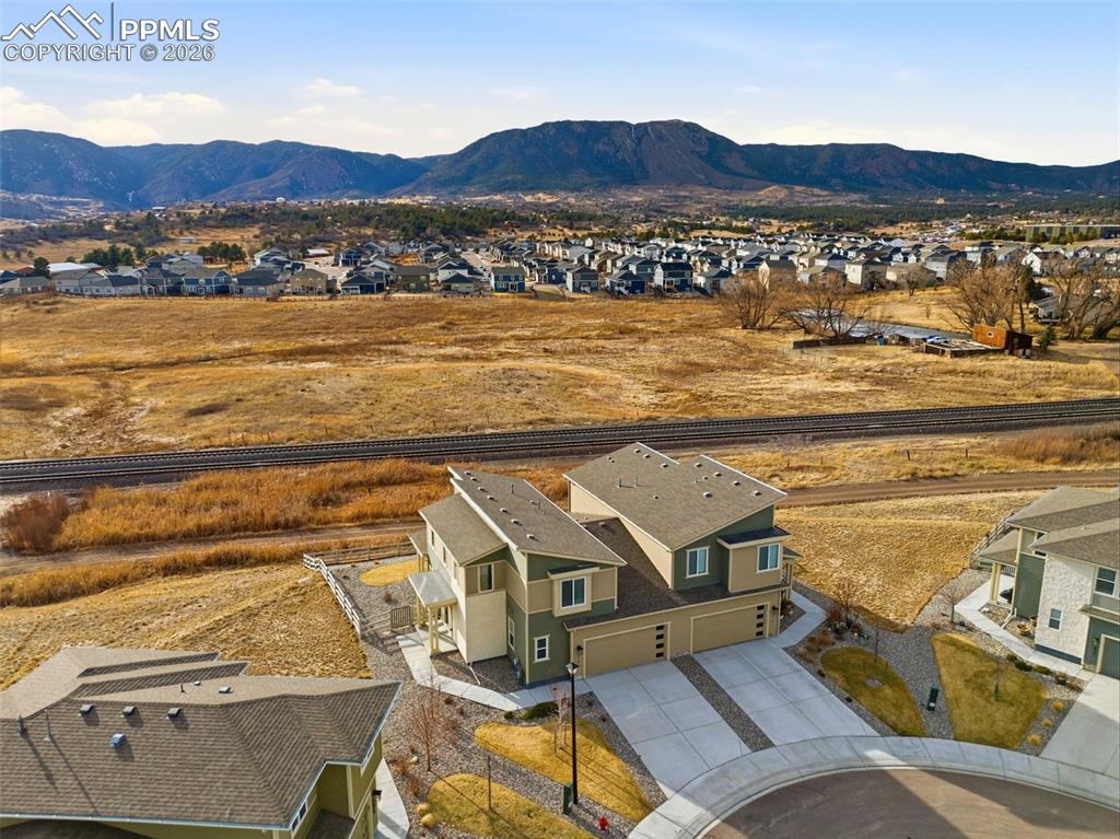 Aerial view of residential area featuring mountains