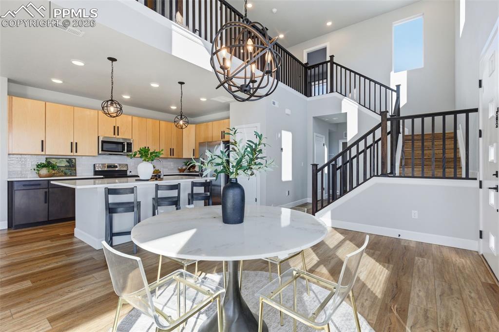 Lots of upgrades with laminate through the first floor, stairs, baths, upscale lighting, cabinetry and so much more!