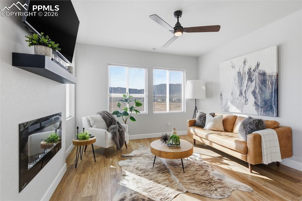 Enjoy the electric fireplace while snuggled in with mountain views