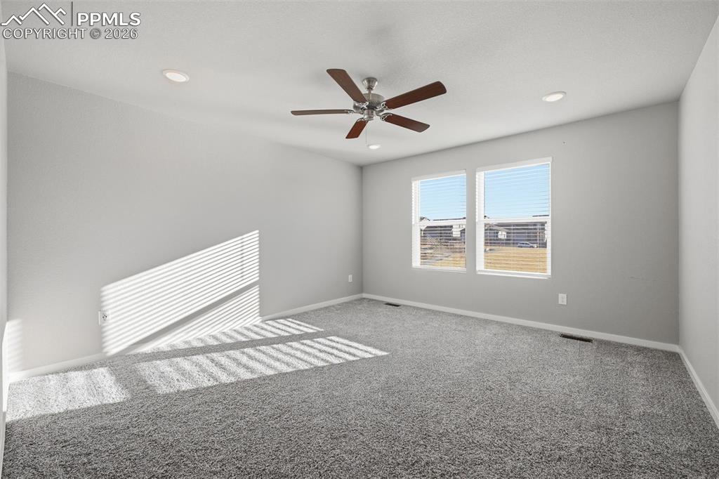 Unfurnished room with carpet flooring, a ceiling fan, and recessed lighting
