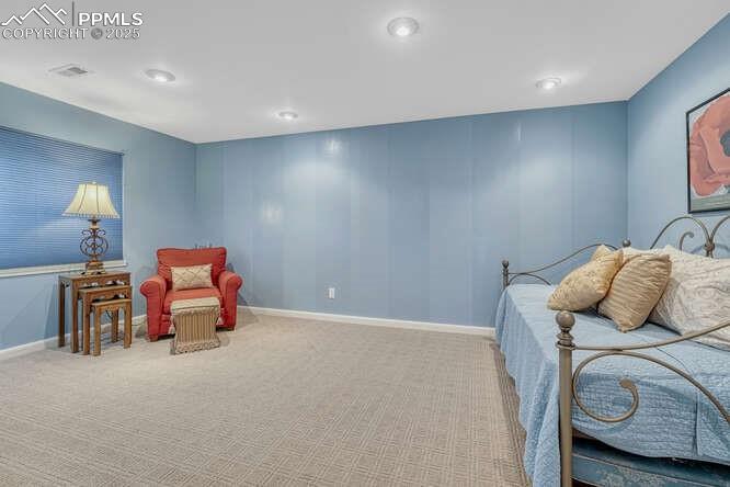 Carpeted bedroom with baseboards