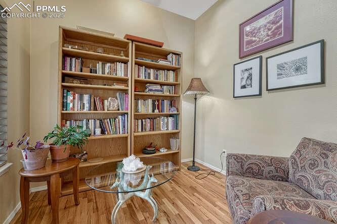 Office/Library area featuring wood floors 