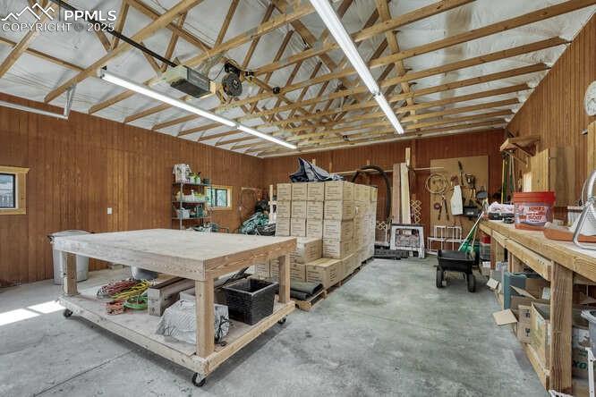 Garage/workshop featuring a heater