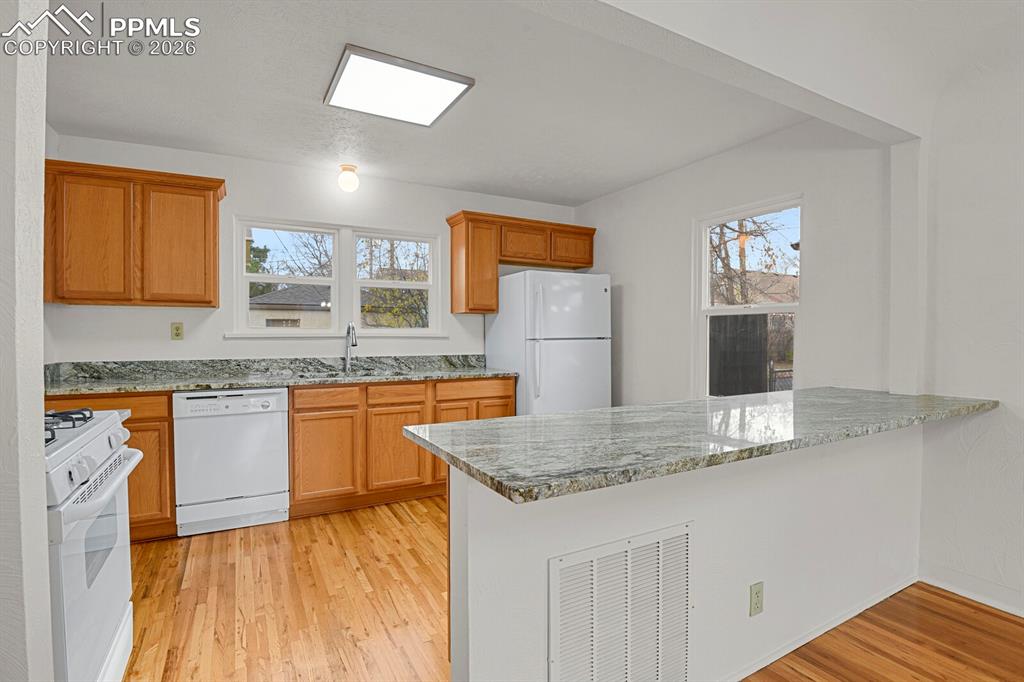 New granite counters, plenty of prep space, and gas range