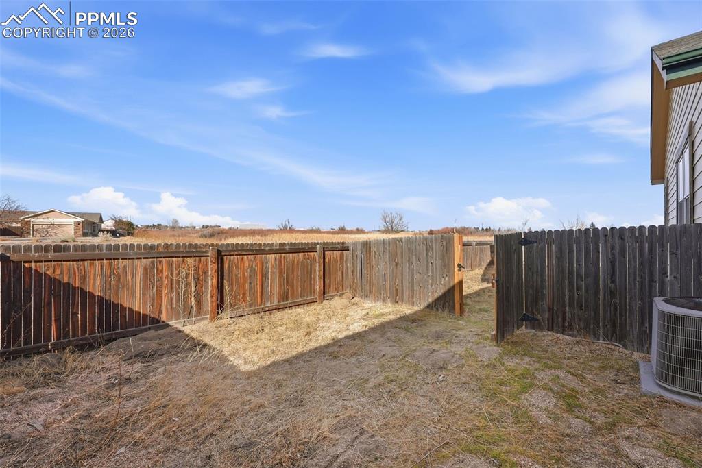 View of fenced backyard