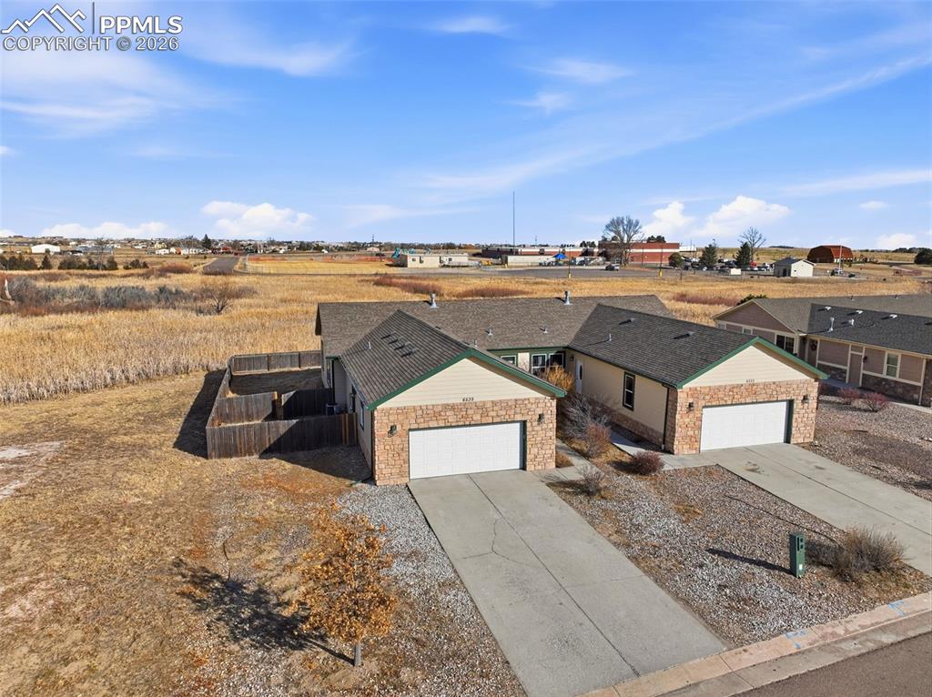 View of front of house featuring driveway and an attached garage