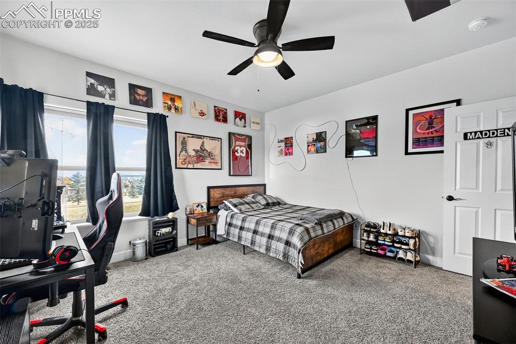 Bedroom with carpet and a ceiling fan