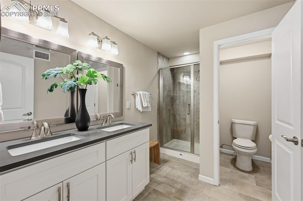 Two walk in closets and en suite to bathroom