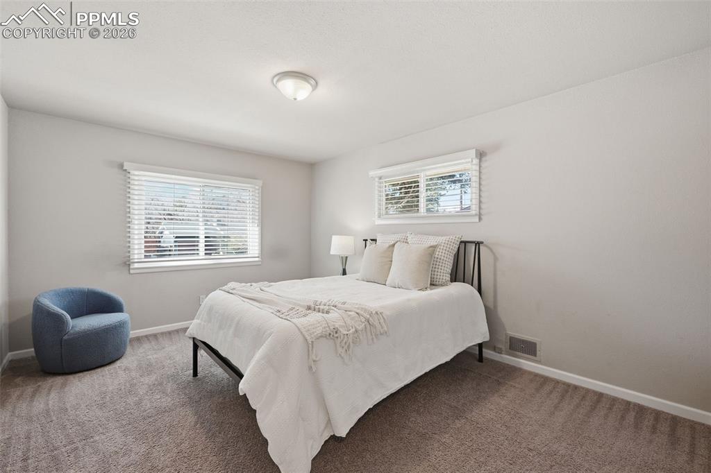 Large sunroom / solarium with vaulted ceilings and access to the back yard