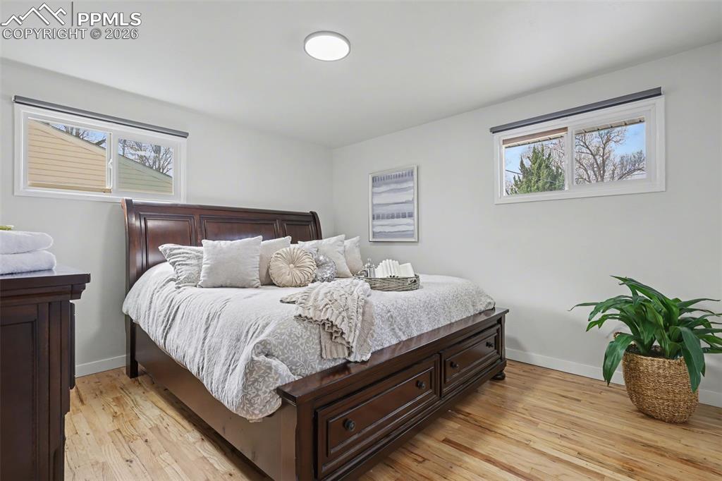 Beautiful master bedroom with hardwood floors and double closets.
