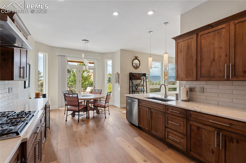 Knotty maple kitchen cabinets with soft close drawers and pull outs