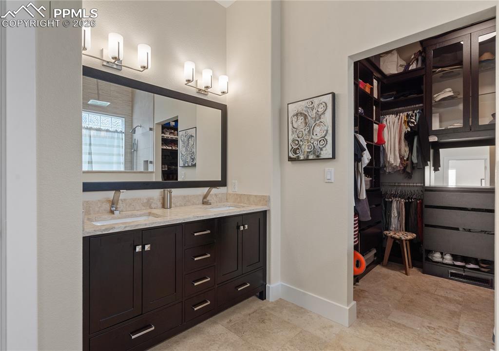 Double sinks and Closet Factory walk in closet in master bathroom