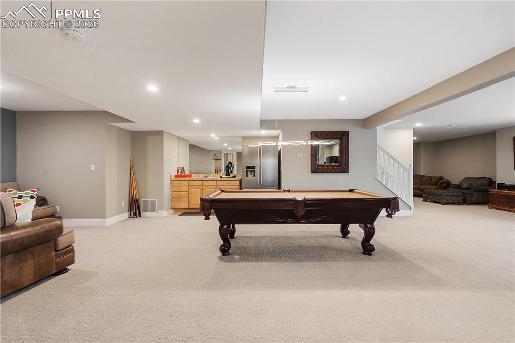 2nd family room in basement has wet bar