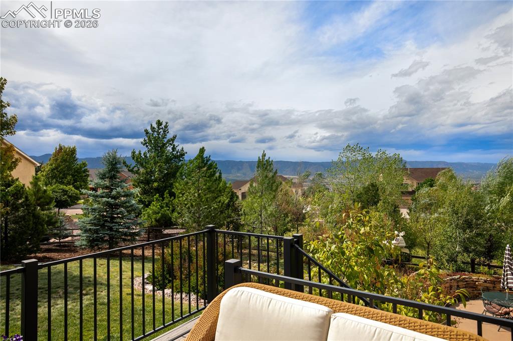 Mountain views, large fenced yard, and low maintenance landscaping in backyard