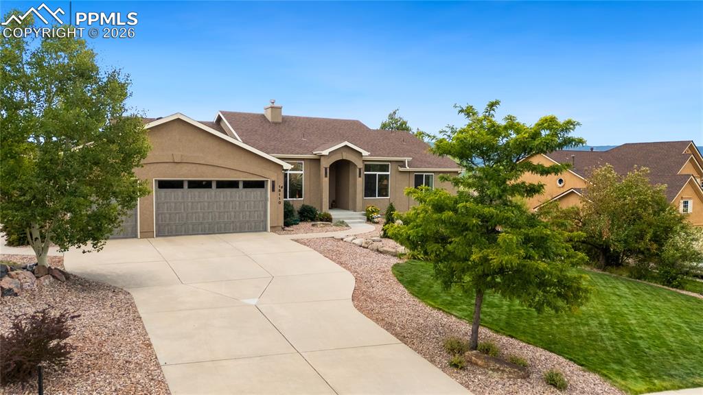 Low maintenance front landscaping, garage is 21' deep, exterior stucco has Sherwin Williams Loxon XP durable coating