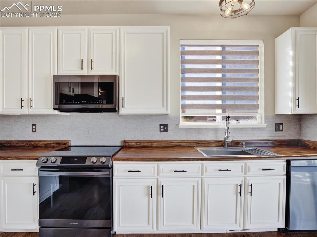 Updated appliances and storage in kitchen