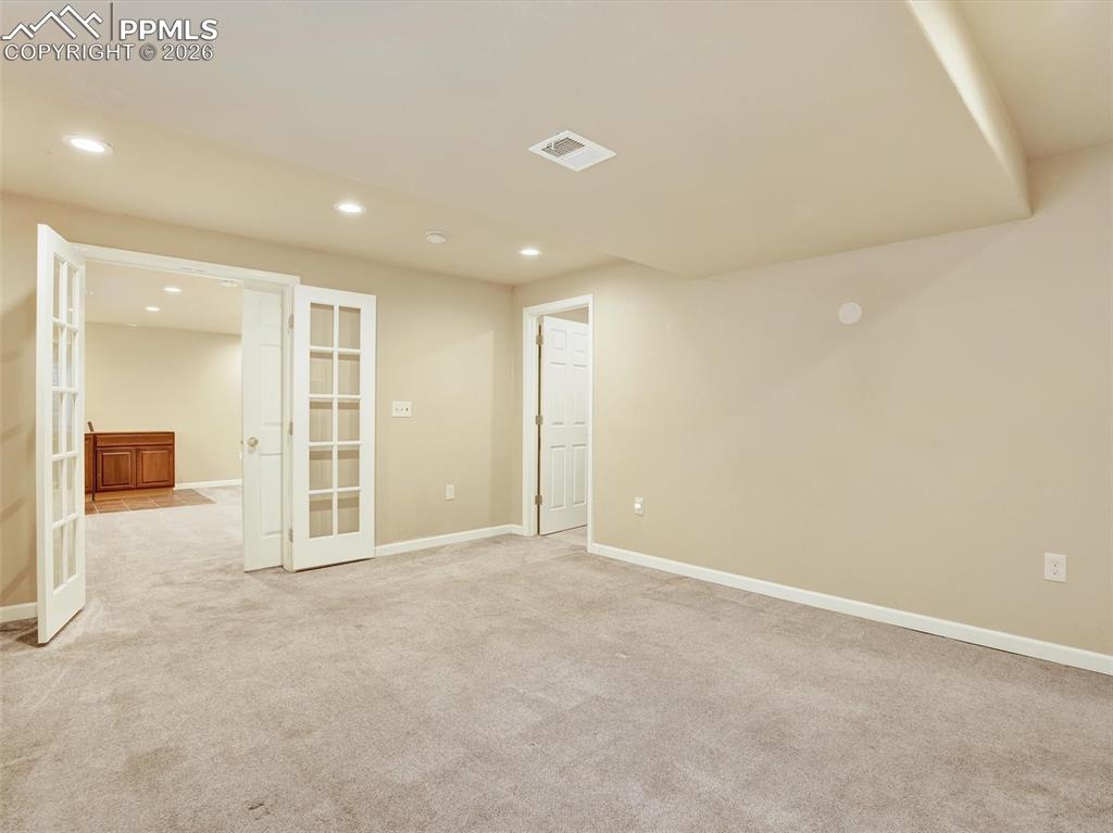 Basement Jr Primary suite with French doors