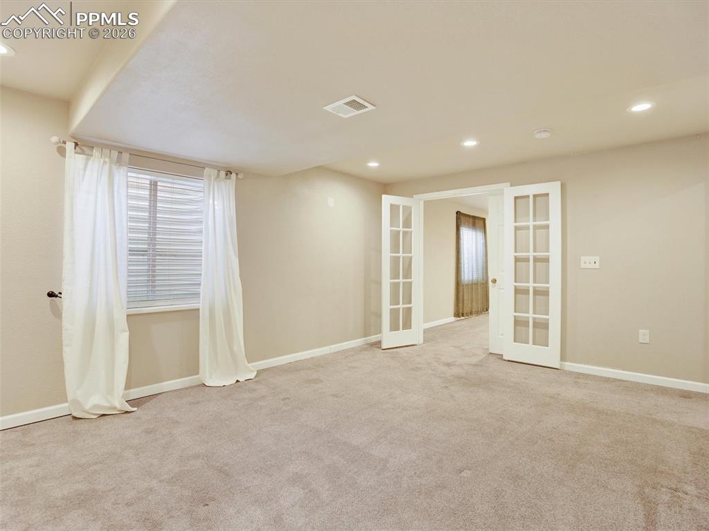 Basement Jr Primary suite with French doors