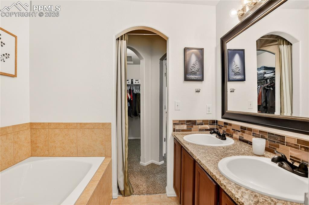 Ensuite Primary Bathroom and Walk-in Closet Beyond