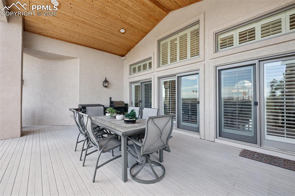Wooden terrace featuring outdoor dining space