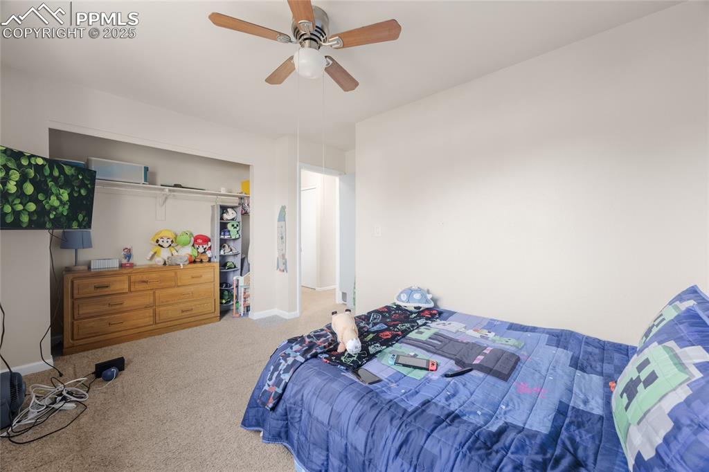 Bedroom featuring carpet floors and ceiling fan