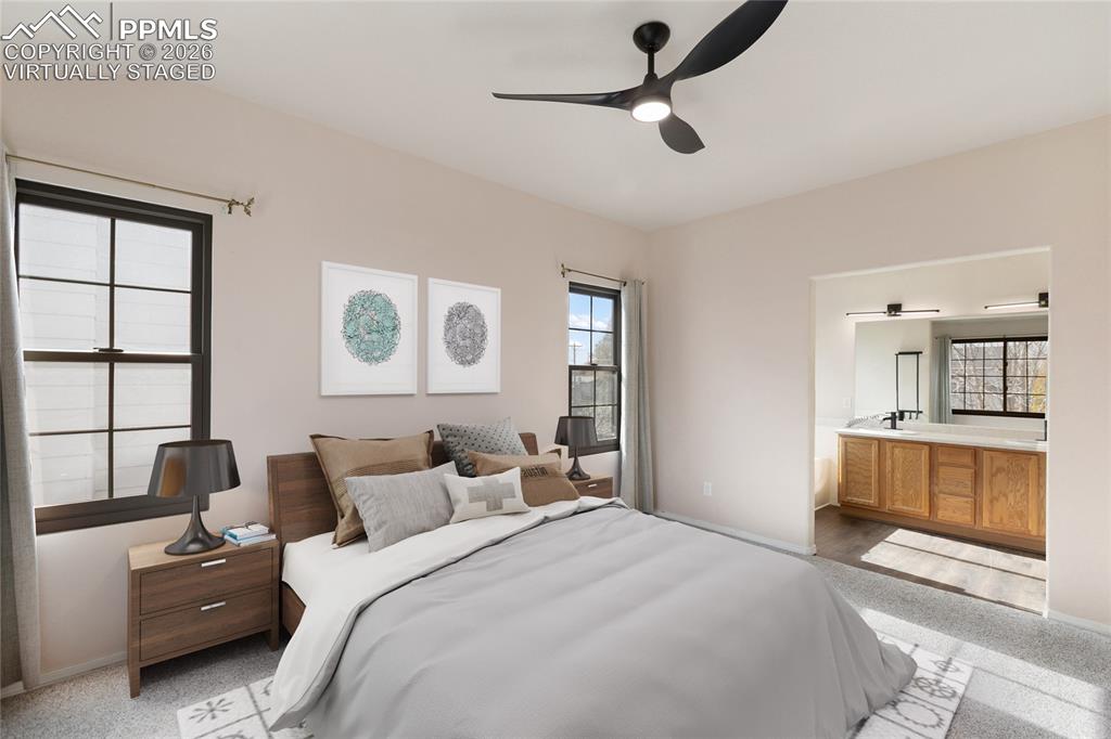 Virtually Staged* Bedroom with multiple windows and a ceiling fan