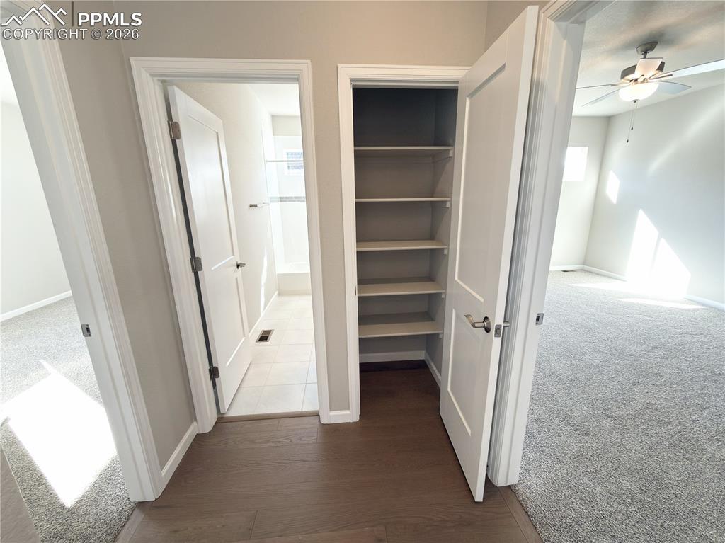 Hallway leading to the Primary Suite, Bedroom 2, and the Hall Bath.