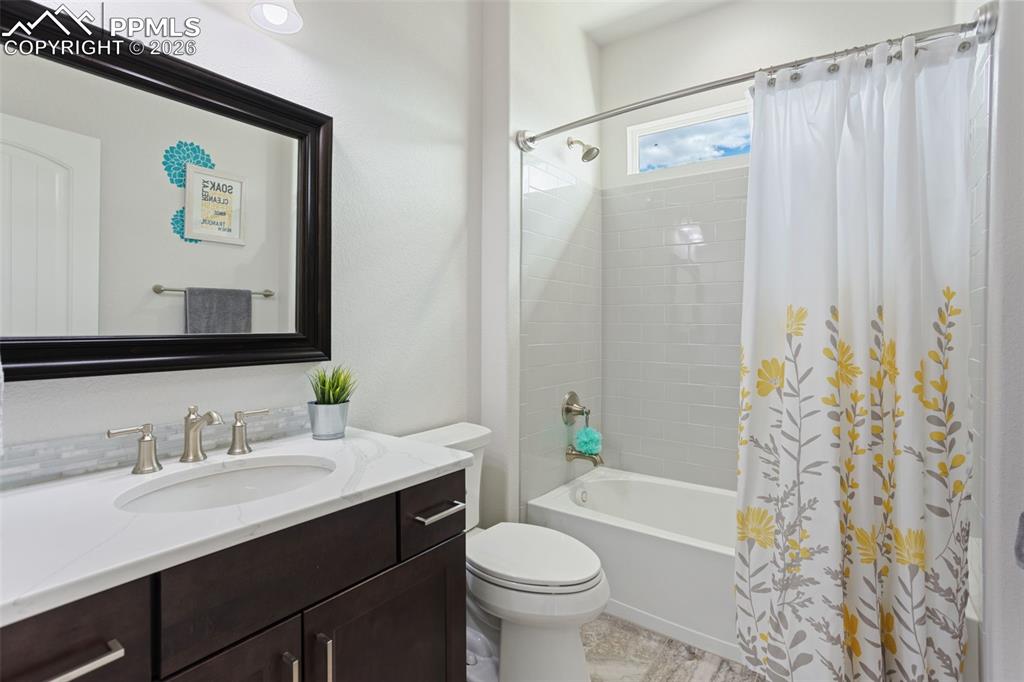 Second full bath on main level adjacent to bedroom/office