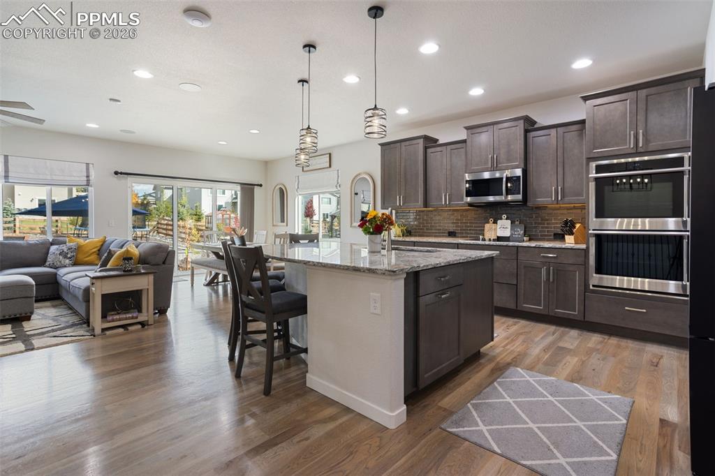 Spacious kitchen with oversized island and double ovens