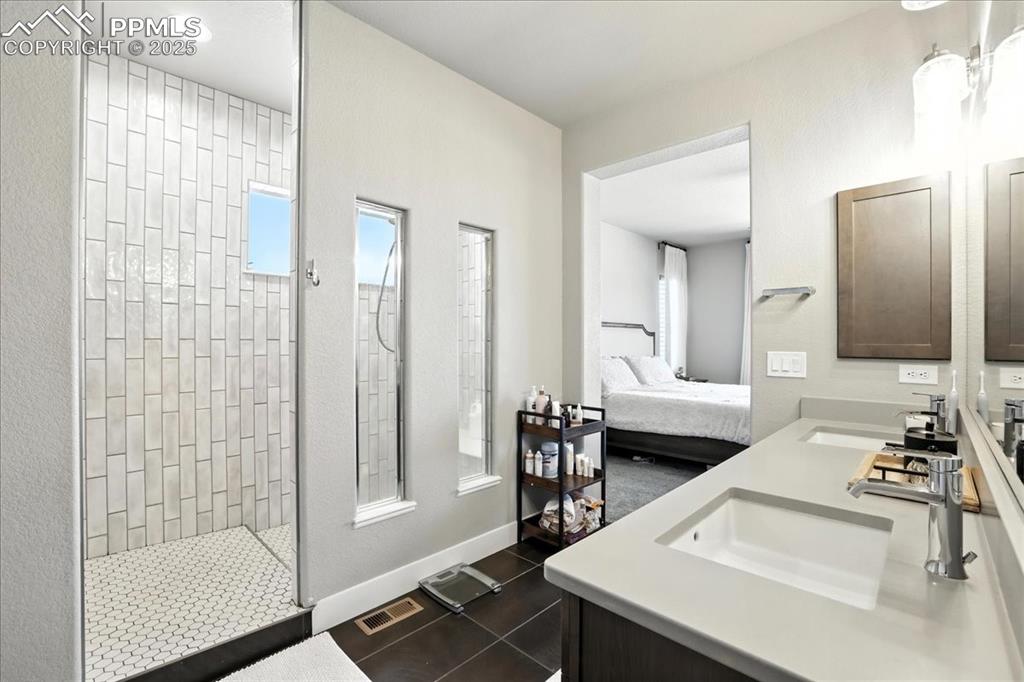 Ensuite bathroom with double vanity and walk in shower