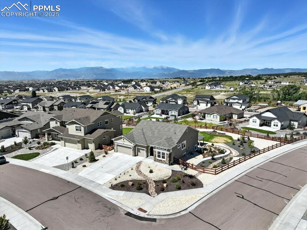 Aerial view of residential area featuring a mountain backdrop