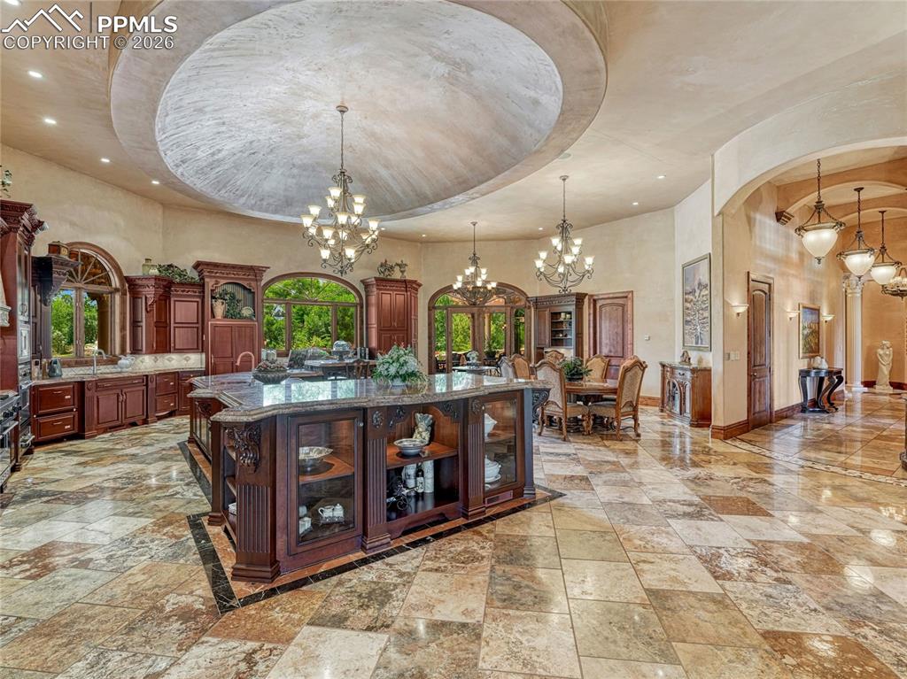 Central Chef's kitchen with multiple indoor/outdoor eating areas.