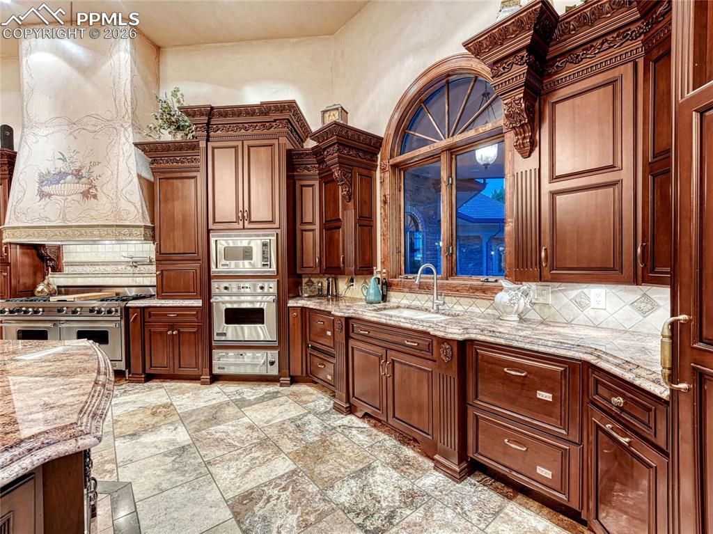 6 dishwasher drawers, 2 sinks, 4 ovens, microwave, ice maker, subzero frig and separate subzero freezer.