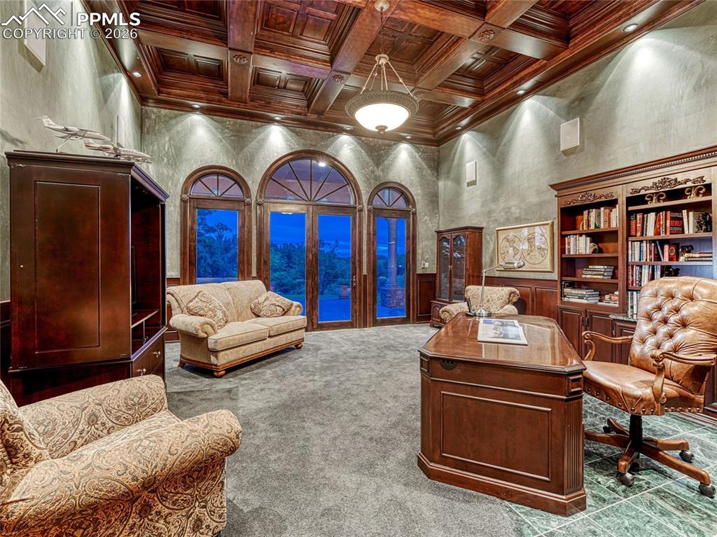 Office space is one of two rooms with a magnificent coffered ceiling.