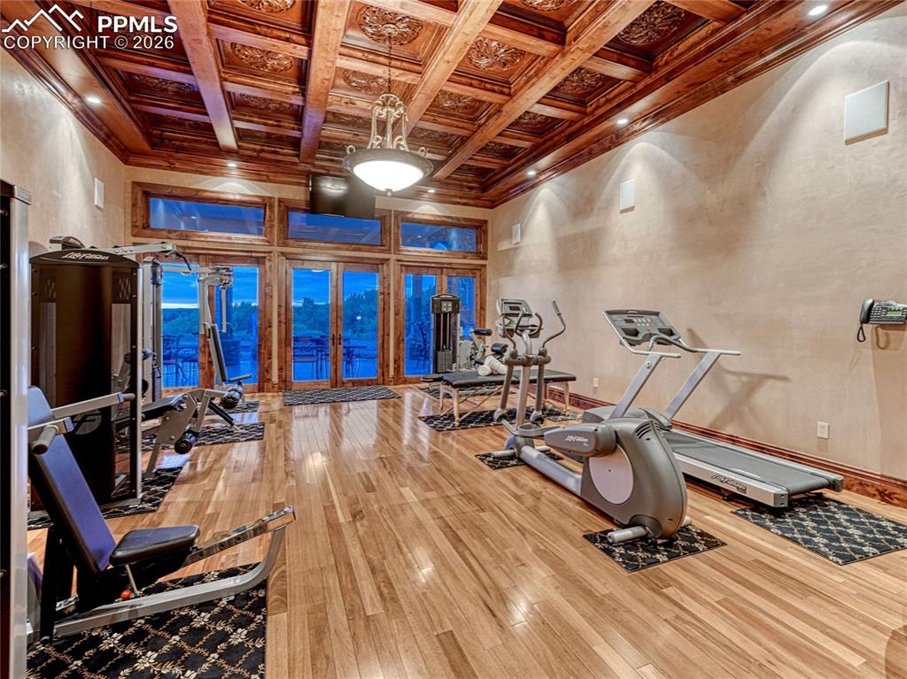 Fitness space is one of two rooms with magnificent coffered ceiling.