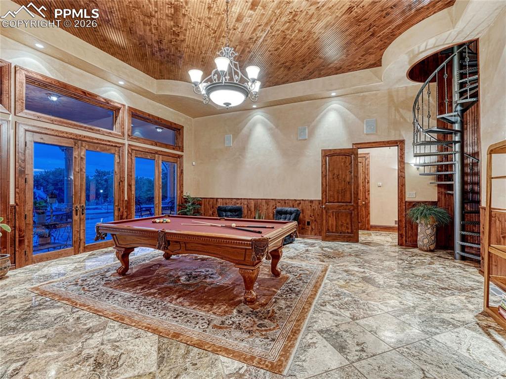 Game room w/outdoor access and spiral staircase leading to observatory.