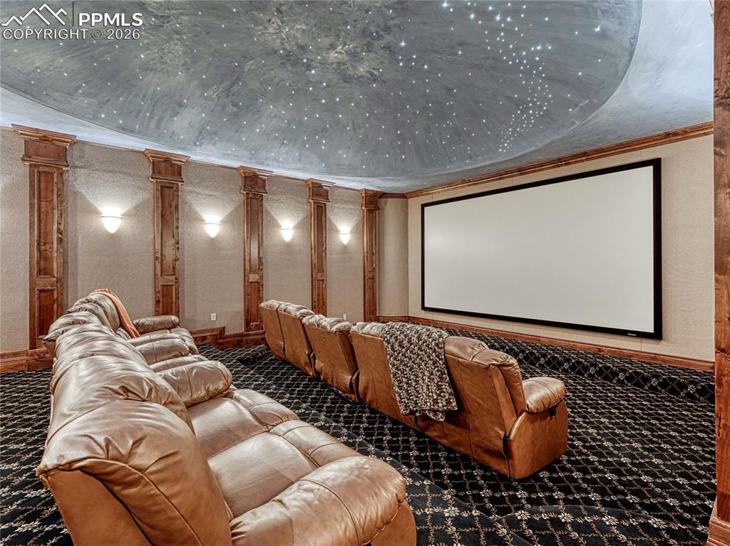 Home media center w/wet bar, stadium seating and domed, fibre optic night-sky ceiling.