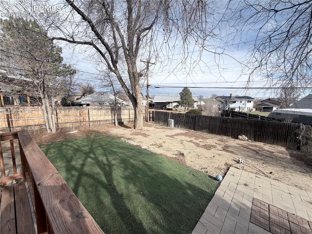 View of fenced backyard