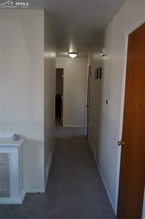 Hall featuring carpet floors