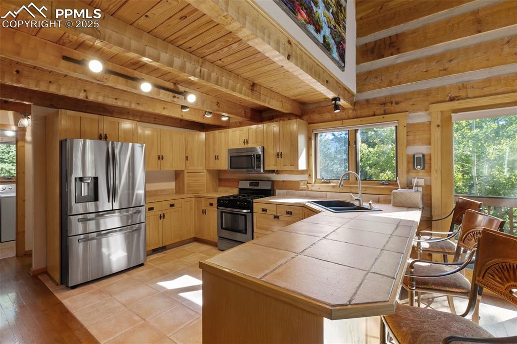 Laundry is on the left. Kitchen window has view to the side yard and driveway.