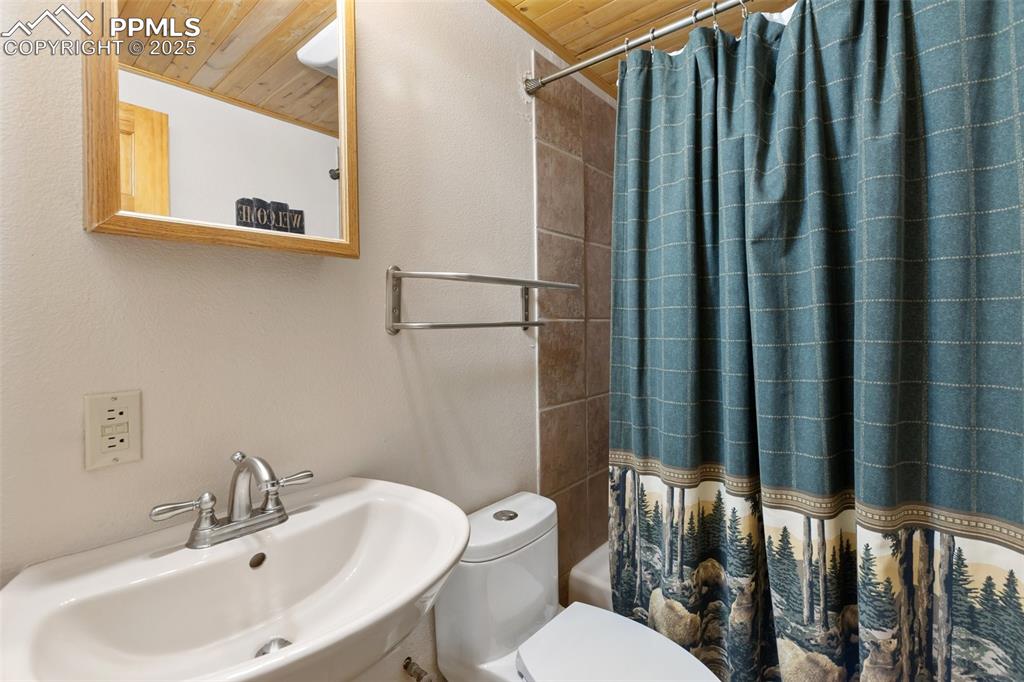 This full bathroom serves the basement level bedroom and family room