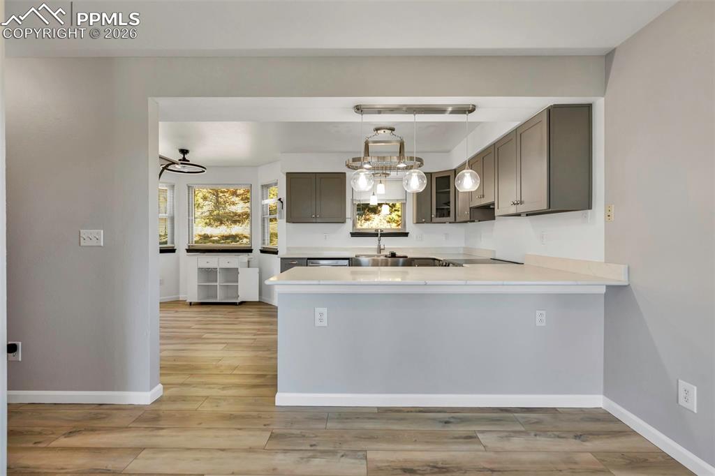 The updated kitchen; completely new in 2024 features new cabinets, countertops, sink and lighting. Great storage space and updated appliances. Clean, modern farmhouse feel that will be your favorite room in the house.