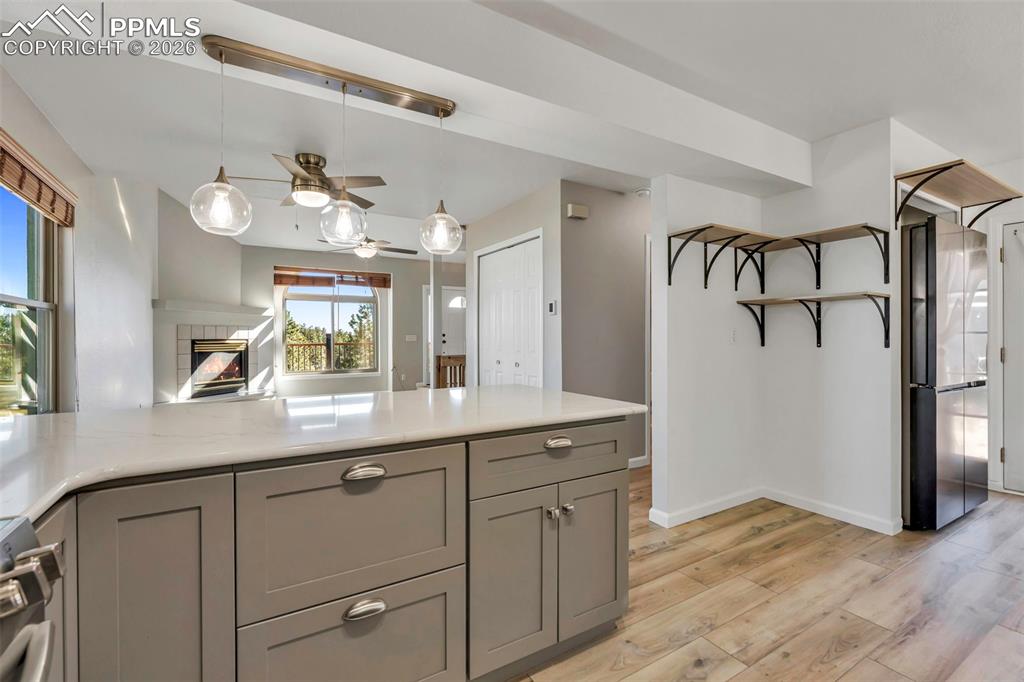 Kitchen is all new with decorative light fixtures, white granite countertops, lots of storage and all appliances included.