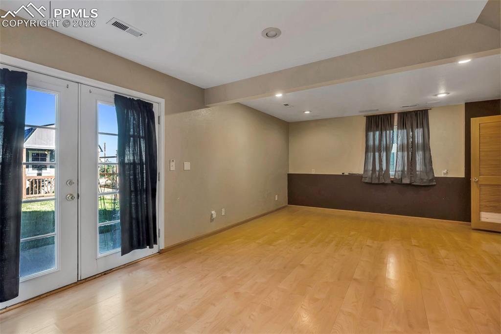 Bedroom or family room; this space in the walk out basement is perfect for any way you decide to use it.  Large walk in closet, private bathroom and back yard and "she shed" access. 