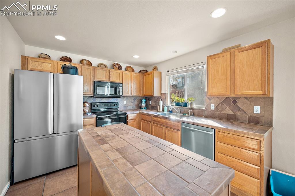 The kitchen has brand new stainless steel appliances
