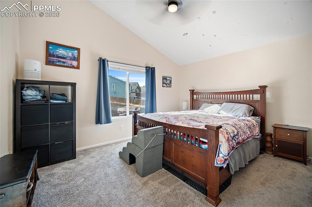 A spacious master suite complete with vaulted ceilings, en suite, and large walk-in closet