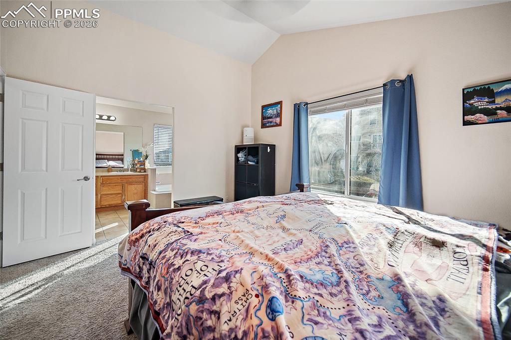 A spacious master suite complete with vaulted ceilings, en suite, and large walk-in closet