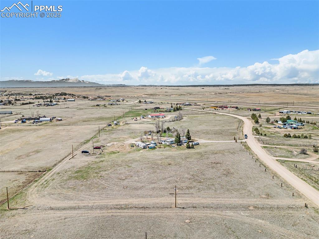 Drone / aerial view with view of desert, a mountain view, and a rural view