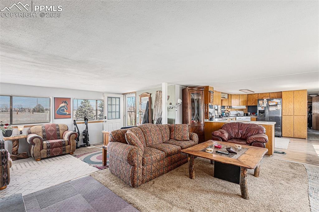 Living area featuring a textured ceiling